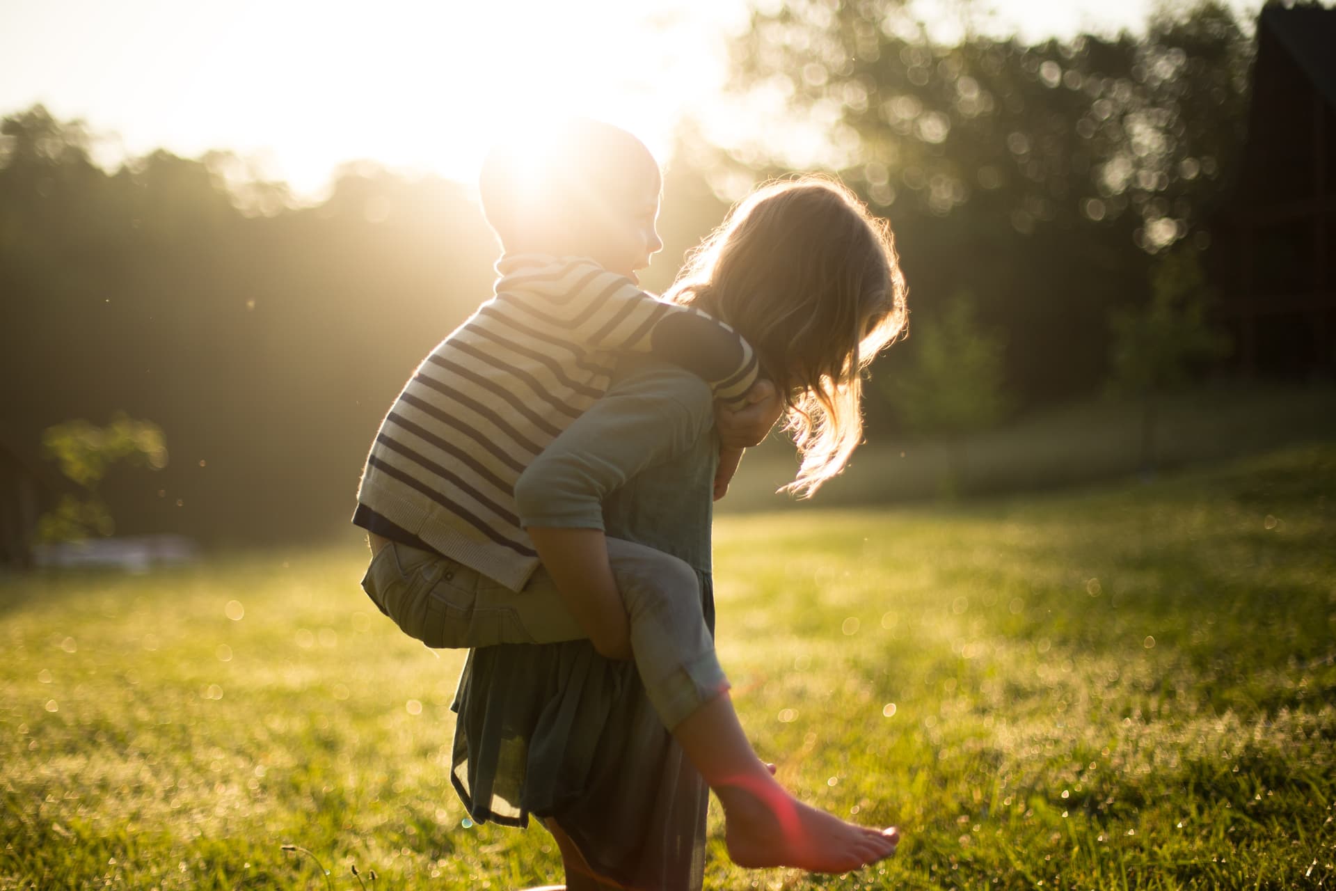 Woman carrying child on back